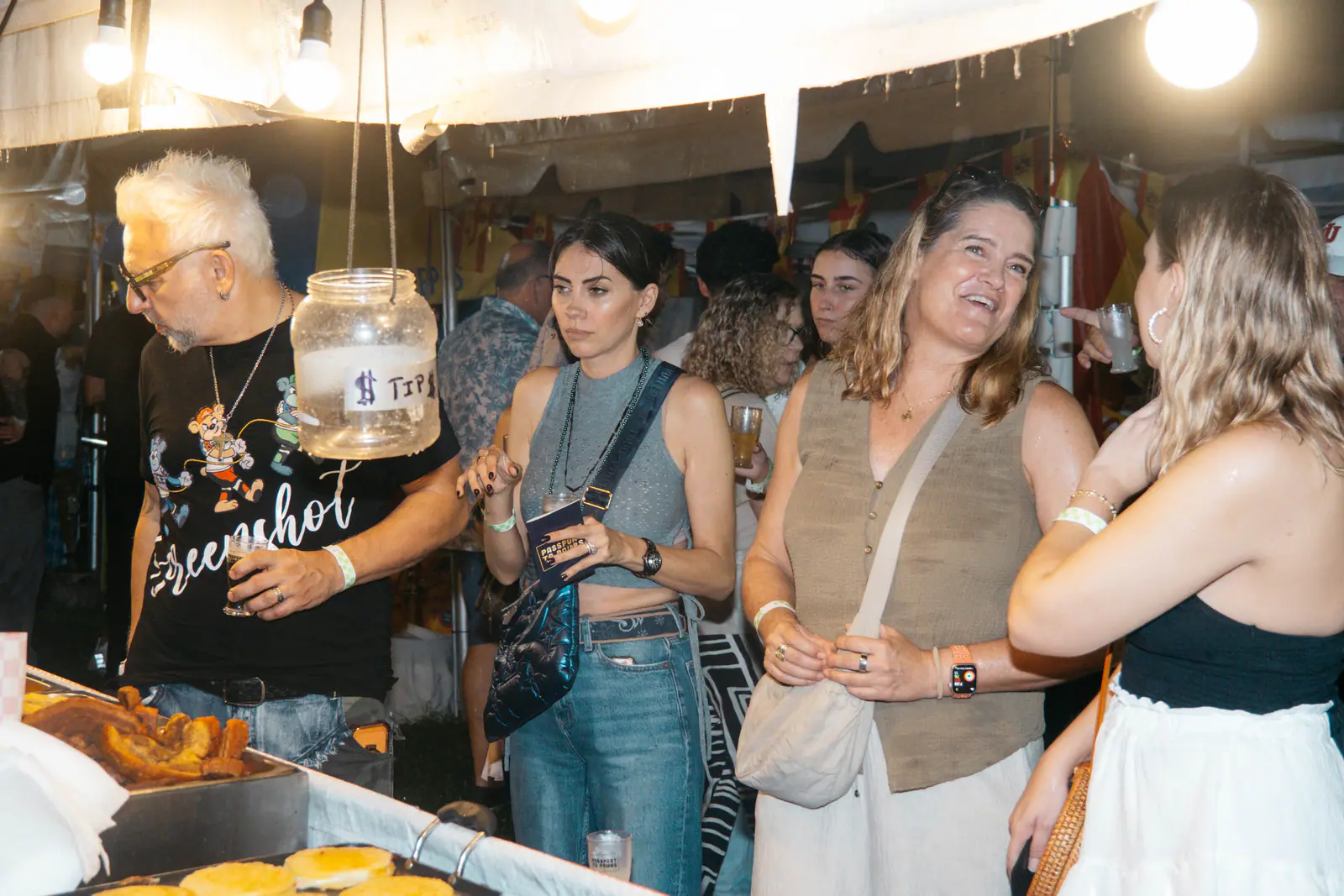 Guests chatting at a vendor tent