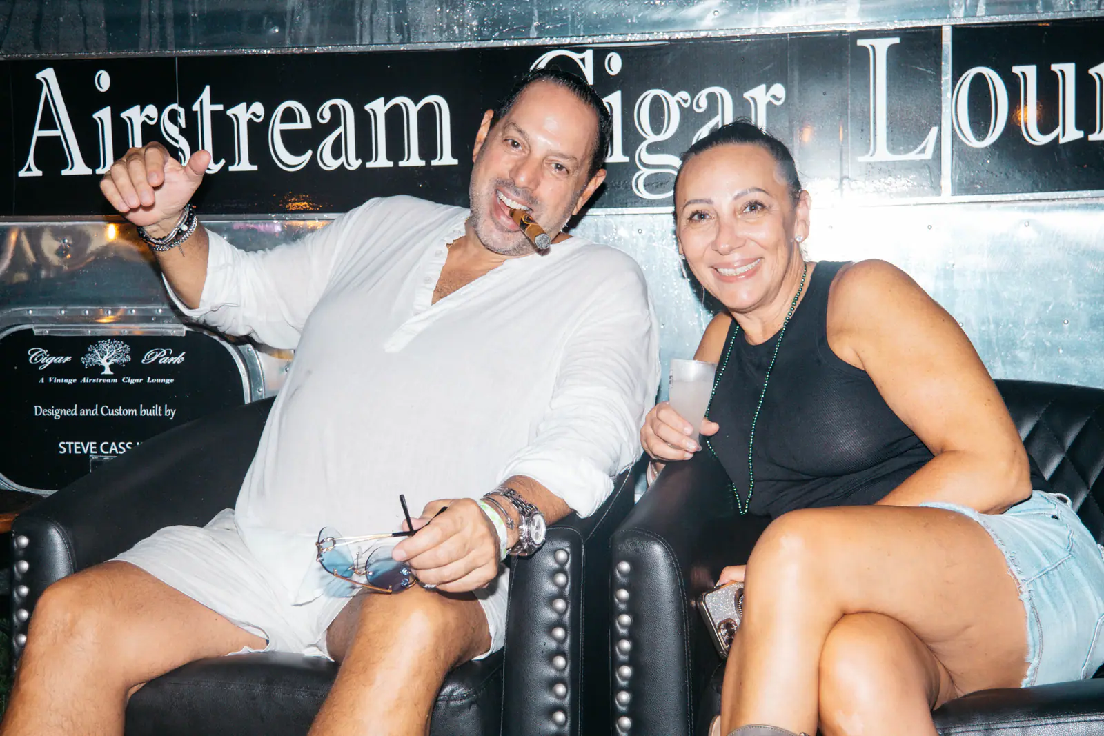 Two guests relaxing at the Airstream cigar lounge