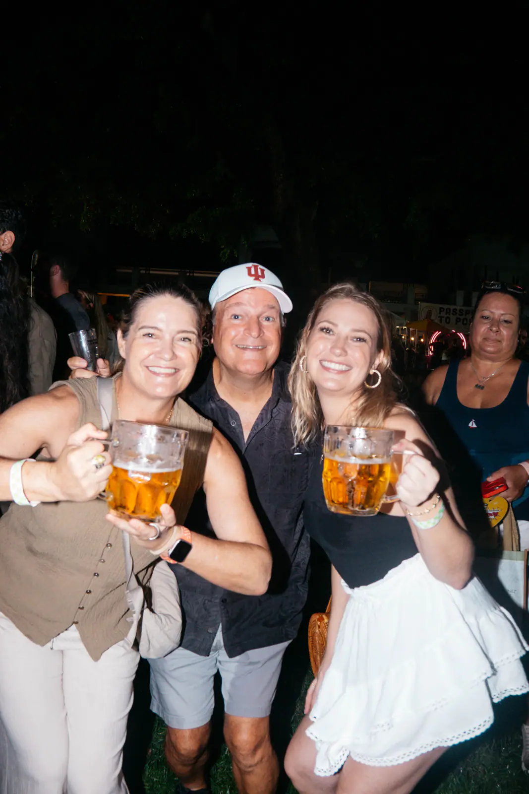 Friends posing with beer steins